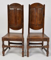 Lot 1243 - A pair of 18th Century oak chairs, each with...