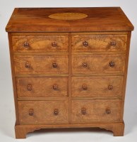 Lot 1250 - An early 20th Century figured walnut chest of...