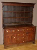 Lot 1262 - An 18th Century oak dresser, the delft rack...