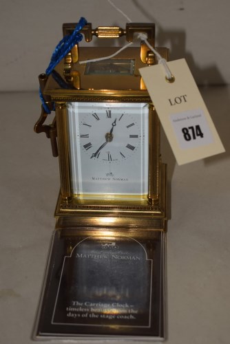 Lot 874 - A brass carriage clock by Matthew Norman,...