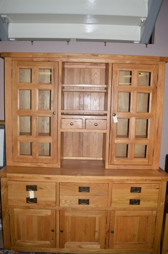 Lot 1194 - A modern oak dresser, with glazed panel doors...