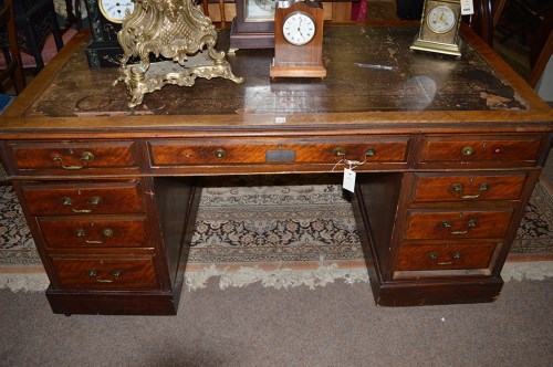 Lot 1340 - A Victorian walnut kneehole writing desk with...