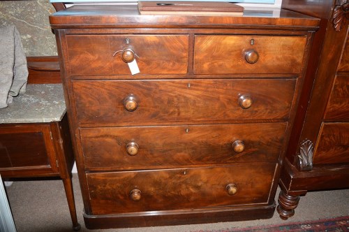 Lot 1407 - A Victorian mahogany chest of two short and...