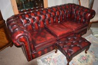 Lot 660 - A modern leatherette three-seater Chesterfield...