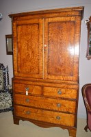 Lot 696 - A reproduction stained wood linen press...
