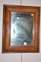 Lot 697 - An antique walnut wall mirror, the associated...