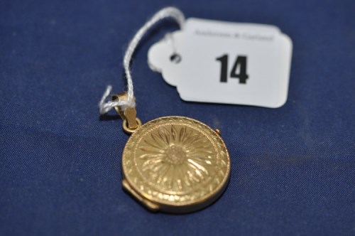 Lot 14 - A yellow metal circular locket pendant, with...