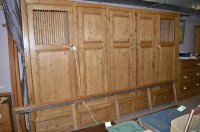 Lot 608 - A large modern polished pine cupboard with...
