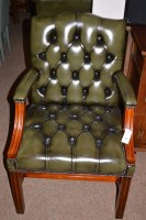 Lot 646 - A pair of green leather covered open armchairs,...