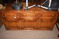 Lot 647 - A 20th Century oak sideboard, fitted three...