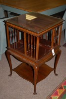 Lot 654 - A Edwardian inlaid mahogany revolving bookcase,...