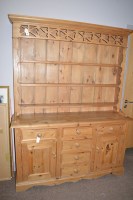 Lot 737 - A stripped pine dresser, the back with pierced...