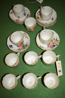 Lot 266 - A set of eleven hand-painted teacups and...