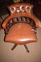 Lot 633 - A 20th Century mahogany and brown leather...