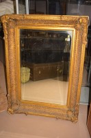 Lot 753 - A 19th Century bevelled wall mirror in ornate...