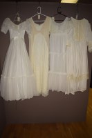 Lot 963 - Four white dresses various, one with hooped...