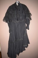 Lot 964 - A black crepe Victorian jacket and skirt with...