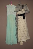 Lot 965 - Two 1960's dresses, one in green with floral...