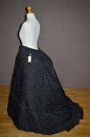 Lot 1017 - A 20th Century seven hoop black quilted...