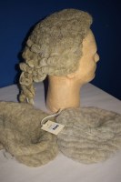 Lot 1100 - A horse hair barrister wig; together with two...