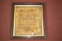 Lot 1105 - A mid 19th Century needlework sampler...