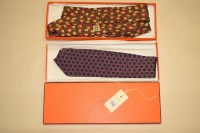 Lot 1114 - Two Hermes silk ties, one tulip design the...