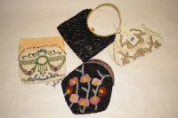 Lot 1116 - An early 20th Century beadwork purse (possible...