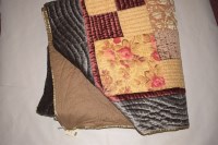 Lot 1134 - A 20th Century patchwork quilt, grey velvet...