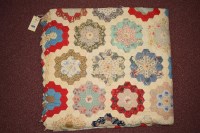 Lot 1138 - A late 19th/early 20th Century patchwork quilt...