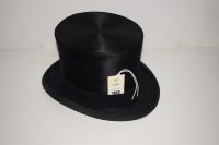 Lot 1153 - A brushed silk top hat, by Lock & Co., London,...