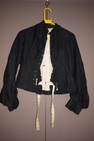 Lot 1182 - A Victorian black cotton jacket with black...