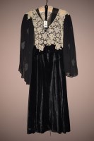 Lot 1189 - An early 1920's black velvet 3/4 length dress...