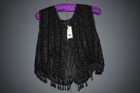 Lot 1194 - A 1920's black beaded waistcoat, tassel...