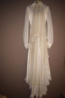 Lot 1249 - A 1970's wedding dress, applied floral...