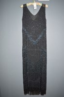 Lot 1262 - A 1920's heavily beaded black silk flapper...