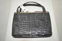 Lot 1264 - A mid 20th Century black crocodile skin...