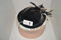 Lot 1265 - A black felt hat, by Frederick Fox, feather...