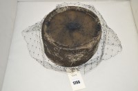 Lot 1266 - A 1960's style pill box hat with black net...