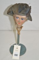 Lot 1267 - A 1920's miniature counter top display hat...