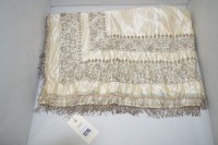 Lot 1275 - A late 19th/early 20th Century cream silk...