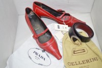 Lot 1293 - A pair of red leather kitten heel shoes, by...