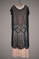 Lot 1301 - A 1920's black flapper dress with beadwork...