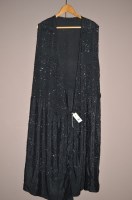 Lot 1306 - A 1920's black silk and beadwork robe/dress,...