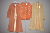 Lot 1341 - A 3/4 length orange suede jacket; an orange...