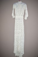 Lot 1345 - An Edwardian tape lace wedding dress, with...