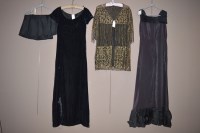 Lot 1348 - A 1930's full-length black dress with ruffled...