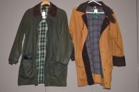 Lot 1359 - A Barbour Game Fair wax jacket; and a...