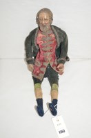 Lot 1363 - A 19th Century Continental male doll in green...