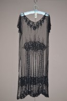 Lot 1373 - A 1920's net and sequin flapper dress,...