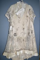 Lot 1377 - A late Victorian cream silk two-piece wedding...